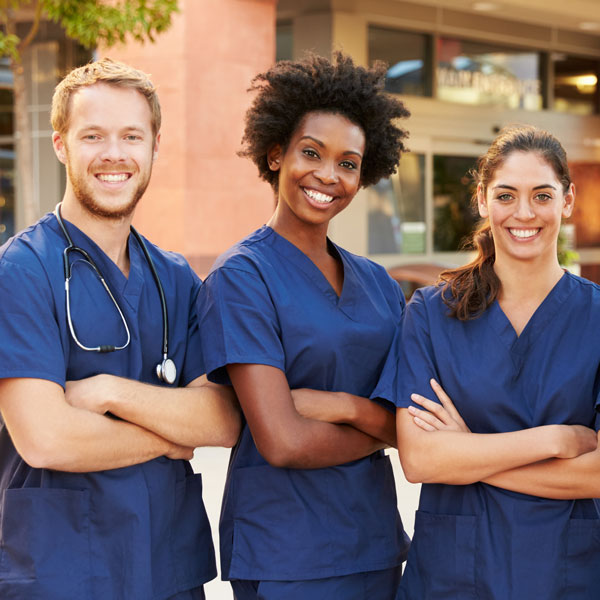 Portrait Of Medical Team Standing Outside Hospital