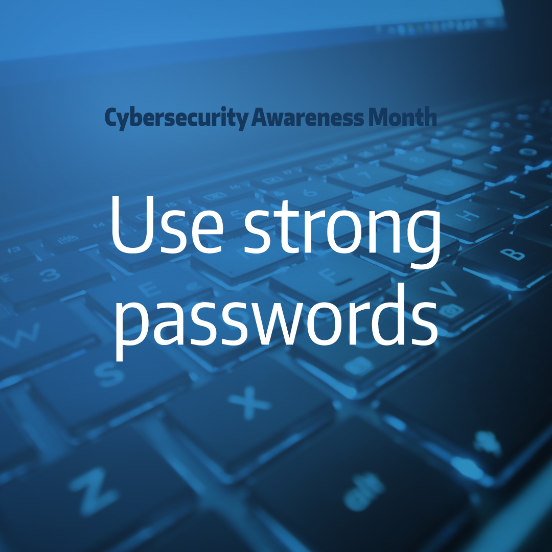 computer keyboard with text overlay "Cybersecurity awareness month use strong passwords"