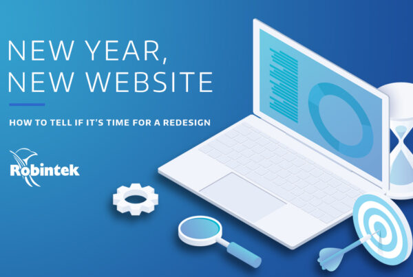 illustration of a laptop, target, magnifying glass, and hour glass with sand running out on blue gradient background with the text overlay "New Year, New Website: how to tell if its time for a redesign"